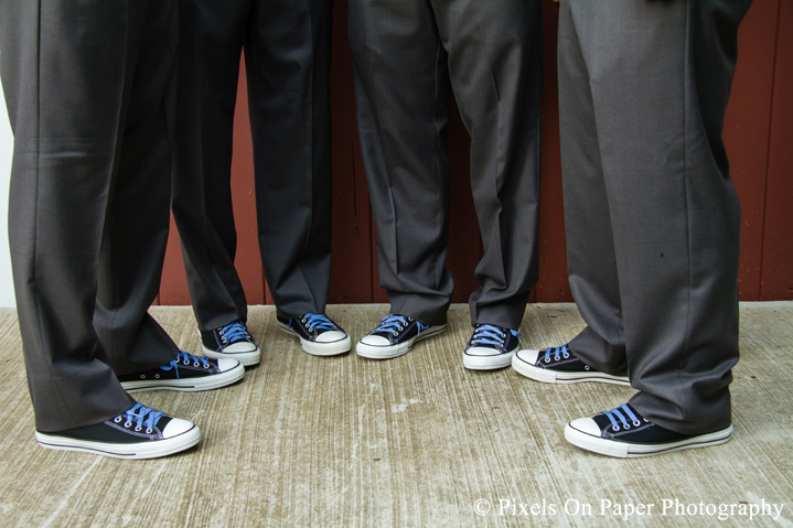 Groom and groomsmen in chuck taylors at outdoor country mountain wedding at big red barn in west jefferson nc photo