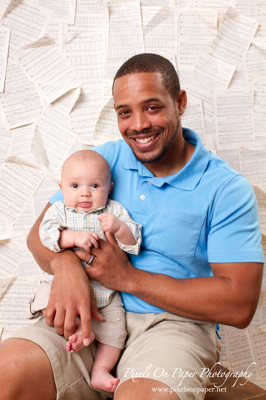 Baby Isaiah with Dad in studio portrait photo