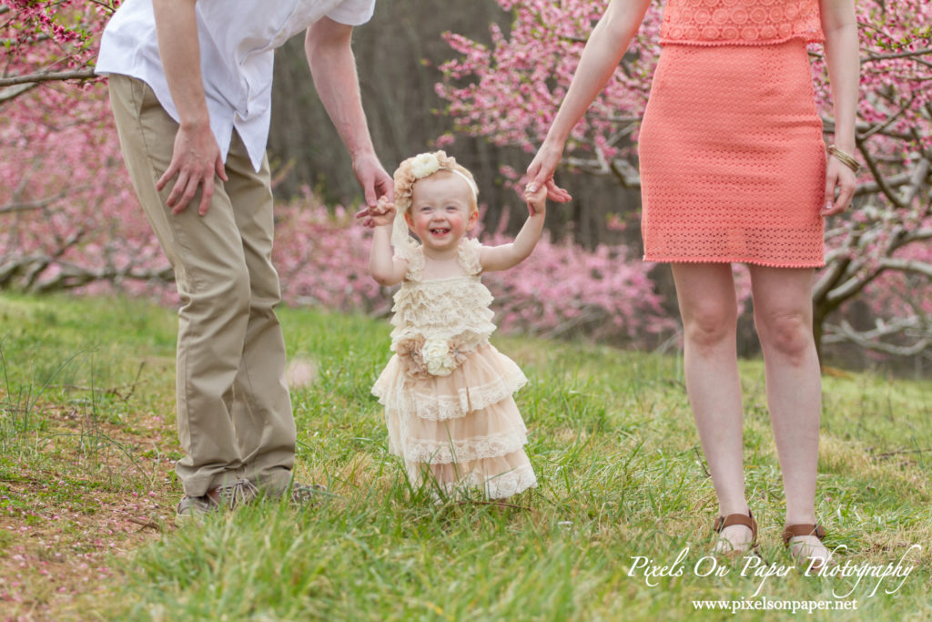 Arnold family outdoor spring peach orchard photos by Pixels On Paper Portrait Photographers photo