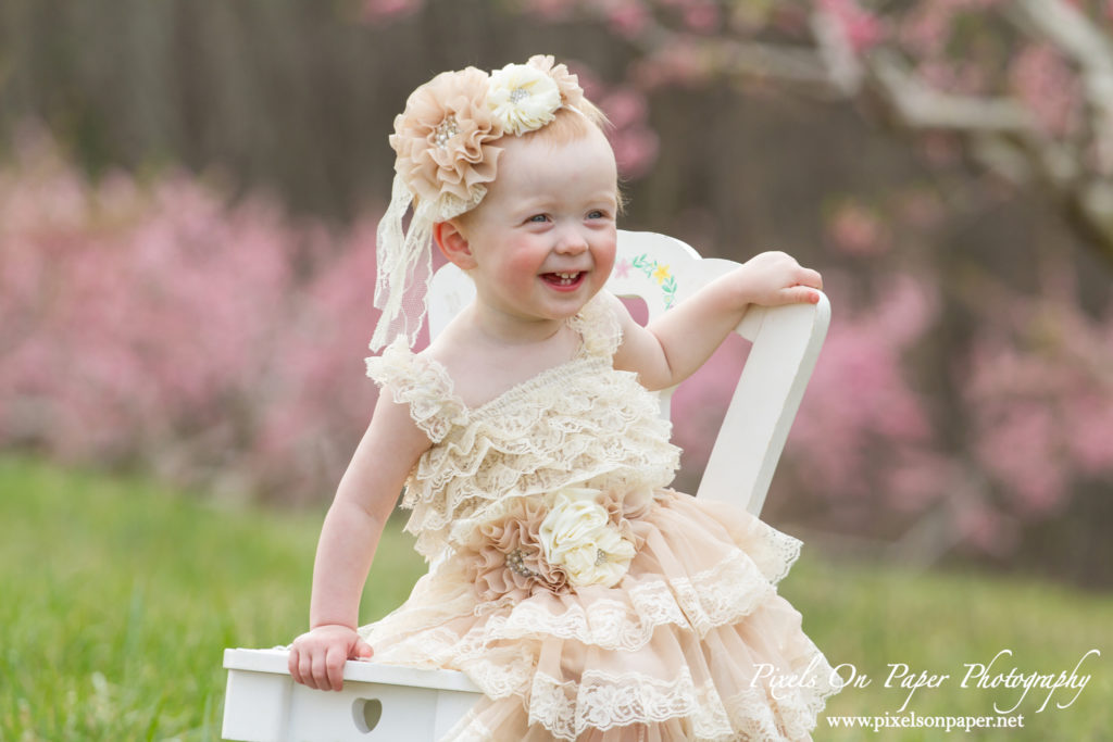 Arnold family outdoor spring peach orchard photos by Pixels On Paper Portrait Photographers photo