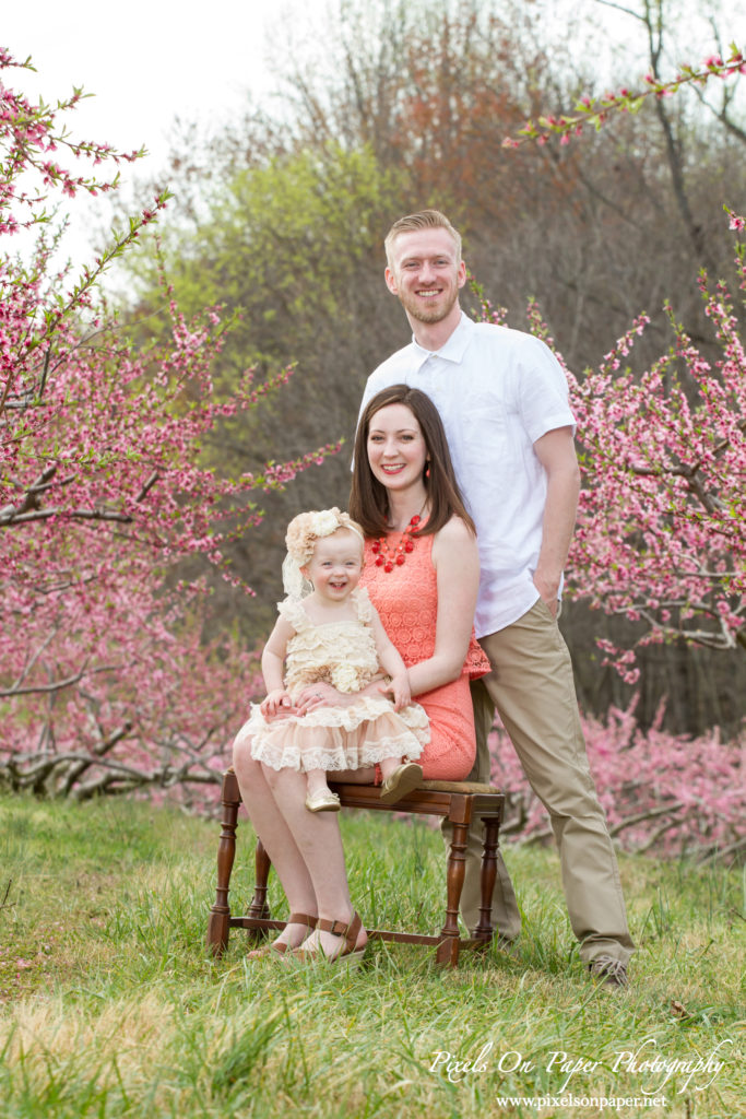 Arnold family outdoor spring peach orchard photos by Pixels On Paper Portrait Photographers photos