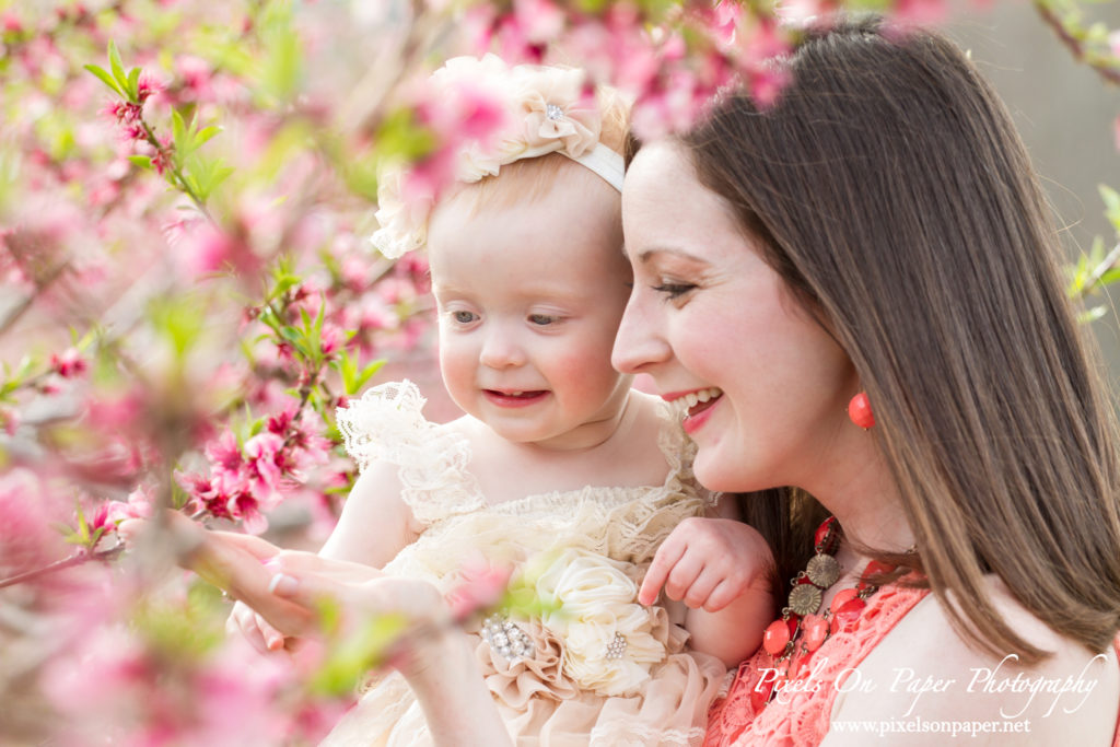 Arnold family outdoor spring peach orchard photos by Pixels On Paper Portrait Photographers photo