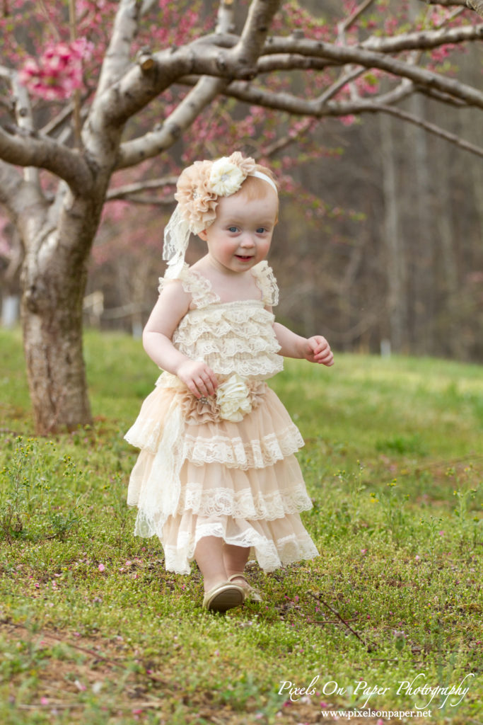 Arnold family outdoor spring peach orchard photos by Pixels On Paper Portrait Photographers photo