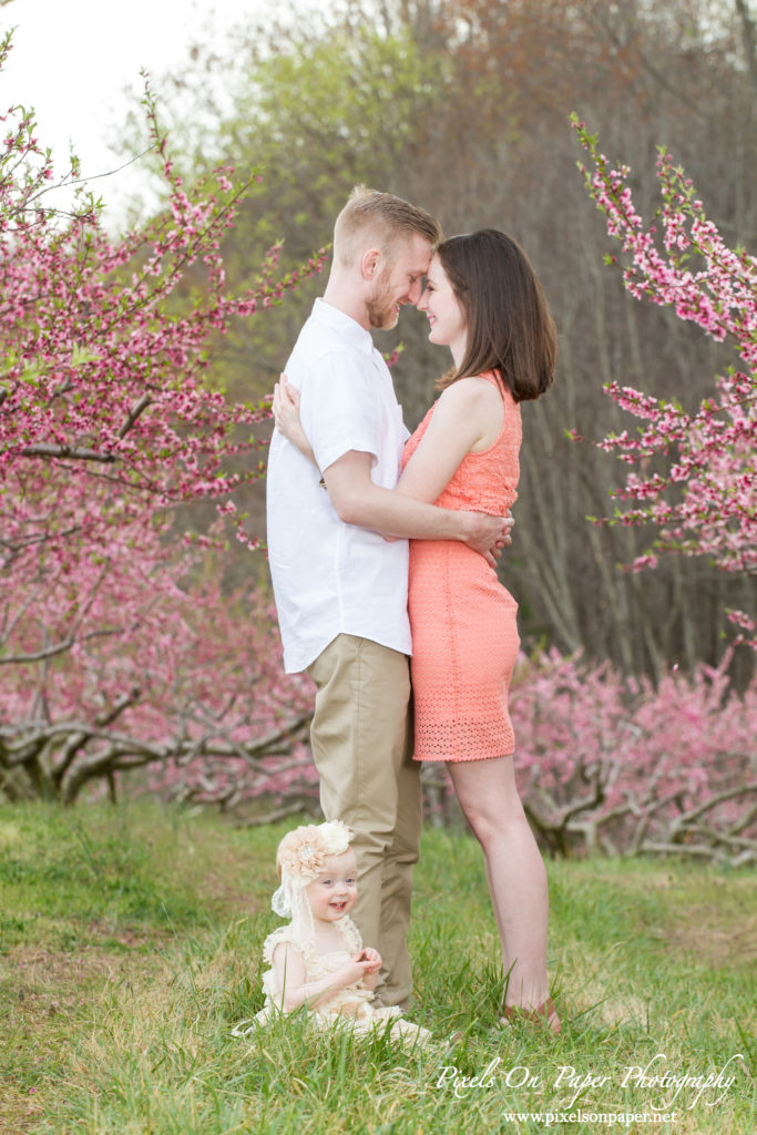Arnold family outdoor spring peach orchard photos by Pixels On Paper Portrait Photographers photos