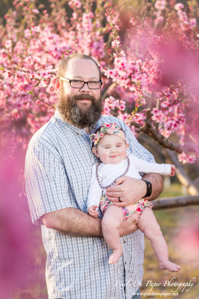 pixels on paper photographers baby senter family outdoor peach orchard portrait photo