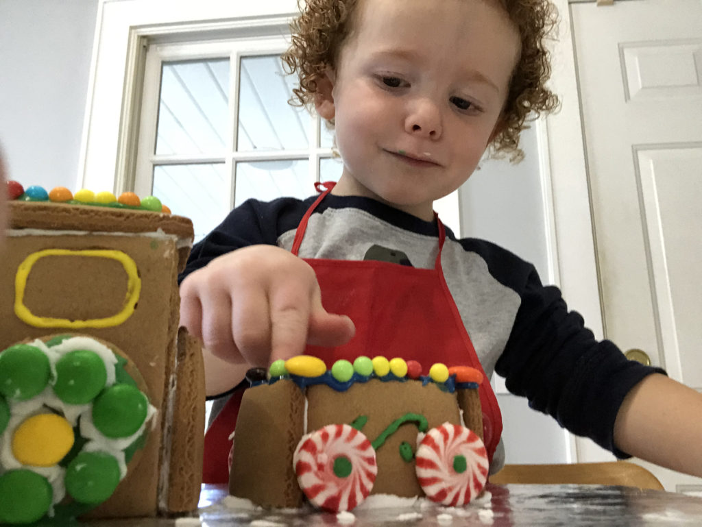 Finley making a gingerbread train photo
