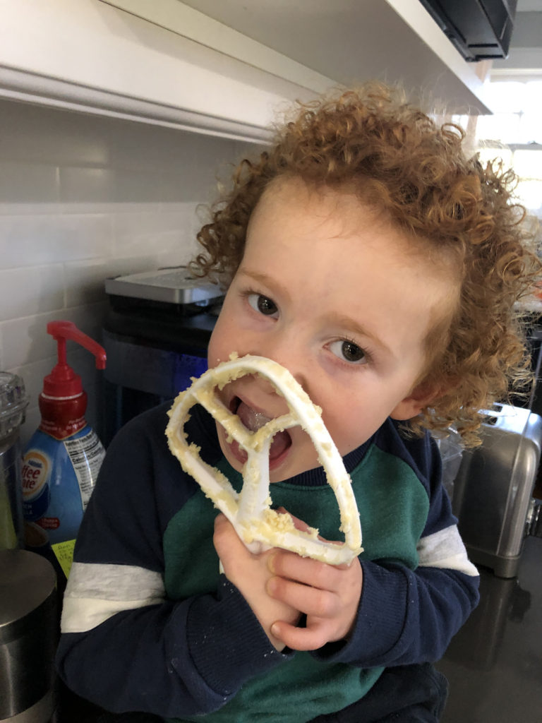 Finley eating cookie batter photo