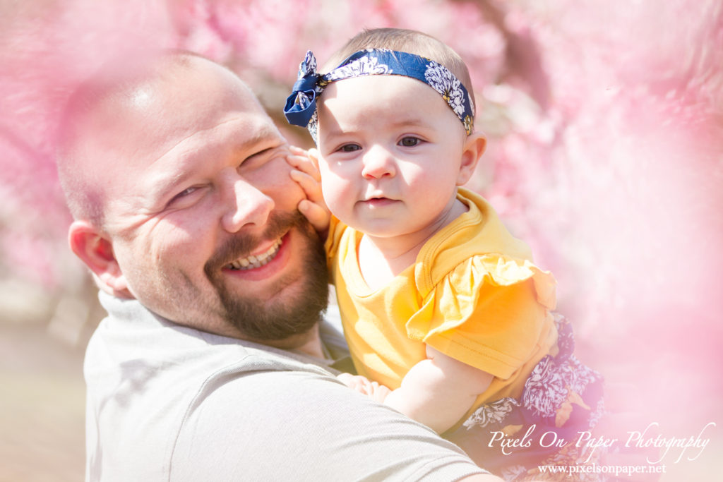 Bennett family and six month old baby girl outdoor peach orchard portrait photo