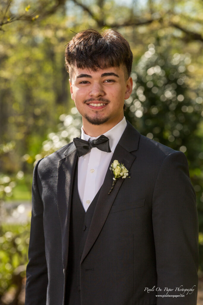 Valek dressed in a sharp prom suit during a professional Wilkes Central High School prom photography session.