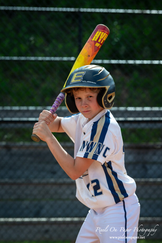 Close-up of NWNC Elite 8U player ready to swing bat during youth sports photography session