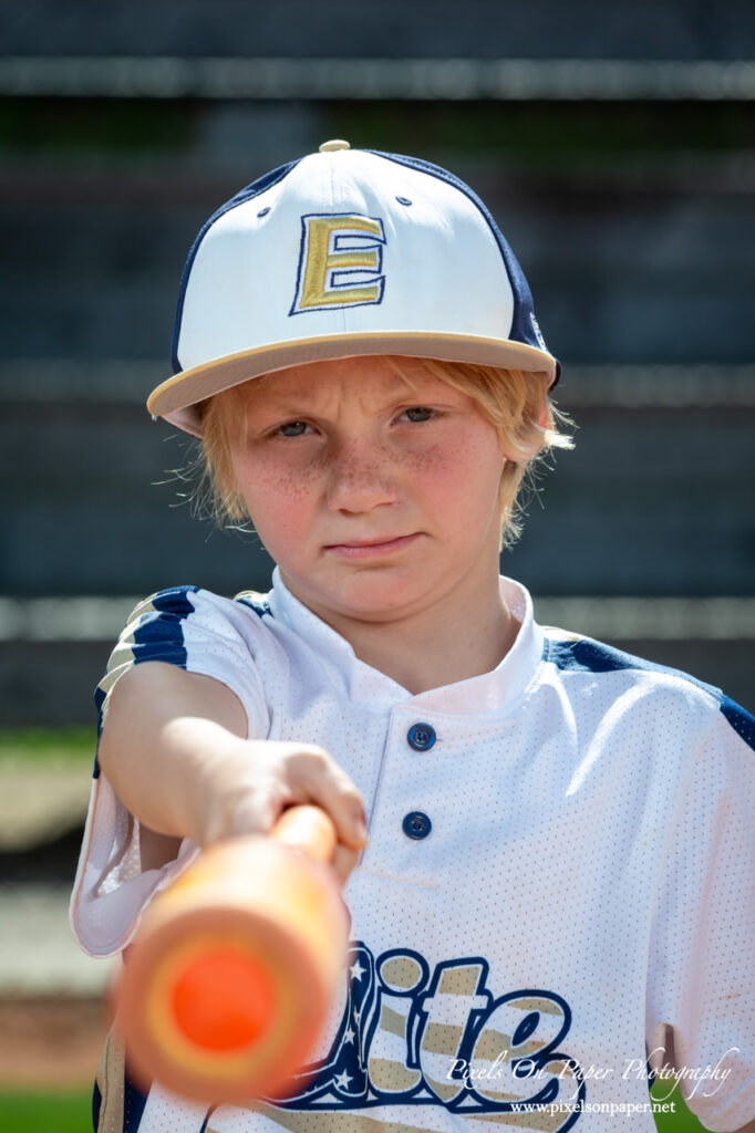 Close-up of NWNC Elite 8U player ready to swing bat during youth sports photography session