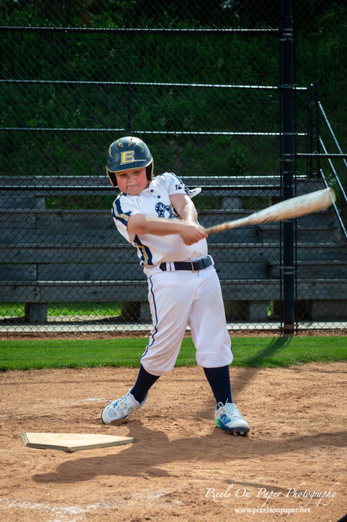 Close-up of NWNC Elite 8U player swinging bat during youth sports photography session