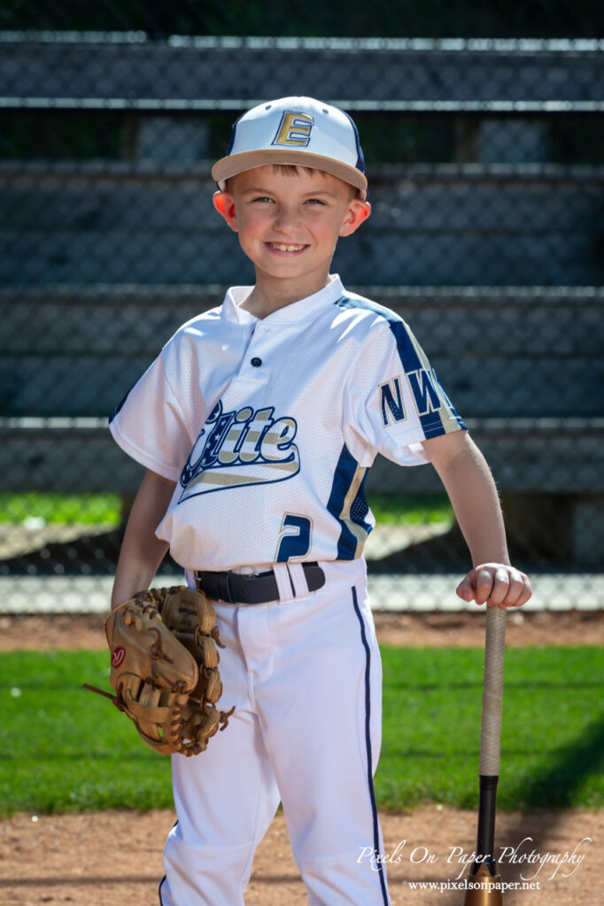 Close-up of NWNC Elite 8U player ready to swing bat during youth sports photography session